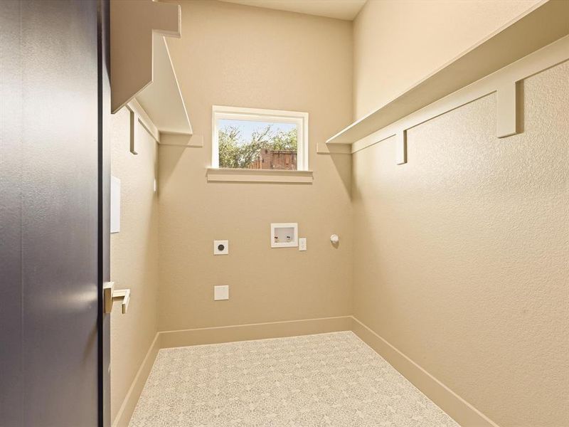 Washroom with washer hookup, hookup for an electric dryer, and hookup for a gas dryer