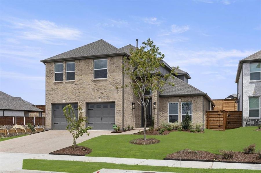 Front exterior of a new home in Solterra, Mesquite, TX, highlighting curb appeal (Image 2).