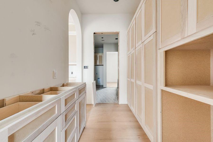 This butlers pantry is loaded with custom shelves & ample storage.