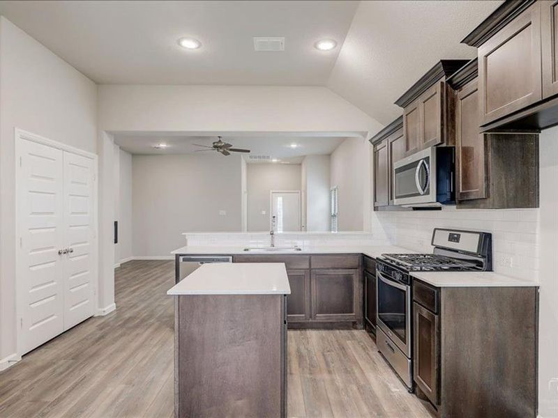 Kitchen in the Amber home plan by Trophy Signature Homes – REPRESENTATIVE PHOTO