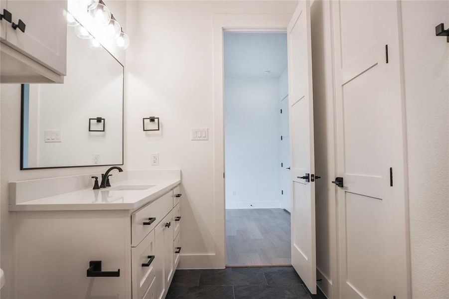 Bathroom featuring vanity and tile patterned floors