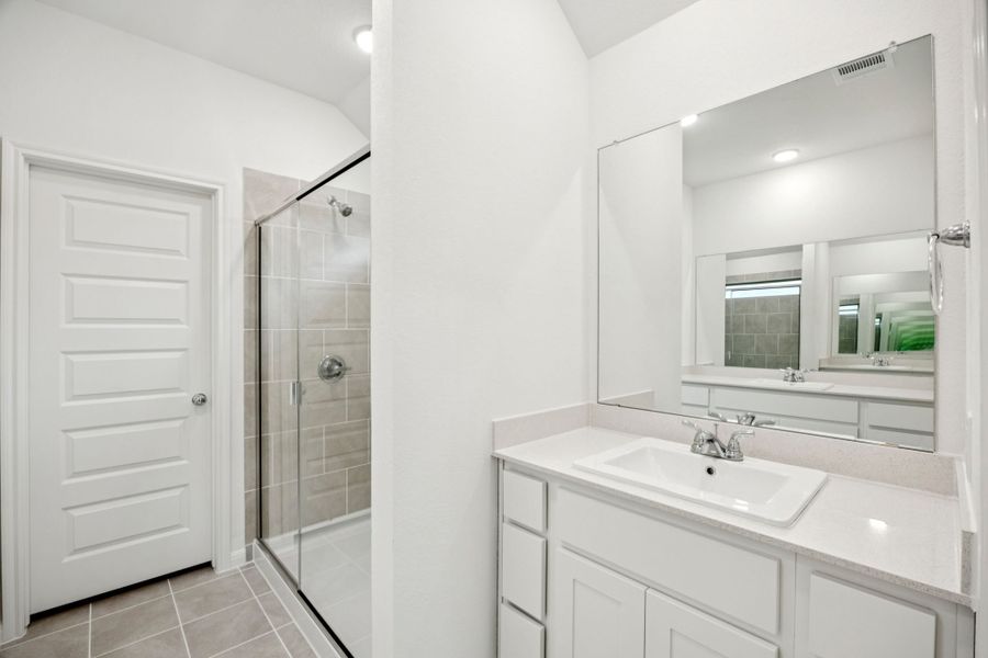 Primary Bathroom in the Spruce home plan by Trophy Signature Homes - REPRESENTATIVE PHOTO
