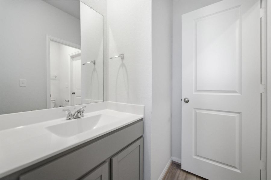 Bathroom with vanity and toilet