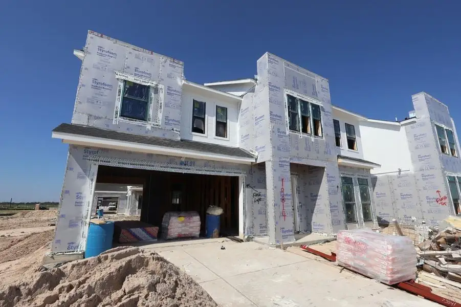 Front exterior of a new home in Easthaven at Bridgeland Central - Vision Collection, Cypress, TX, highlighting curb appeal (Image 2). Front exterior of a new home in Easthaven at Bridgeland Central - Vision Collection, Cypress, TX, highlighting curb appeal (Image 2).