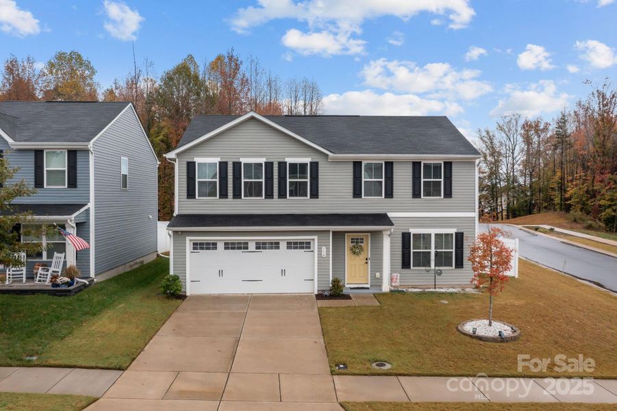 Front exterior of a new home in , Troutman, NC, highlighting curb appeal (Image 25).