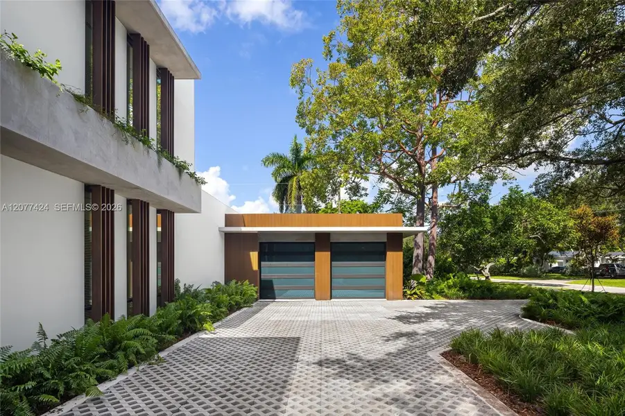 Front exterior of a new home in , Pinecrest, FL, highlighting curb appeal (Image 2). Front exterior of a new home in , Pinecrest, FL, highlighting curb appeal (Image 2).