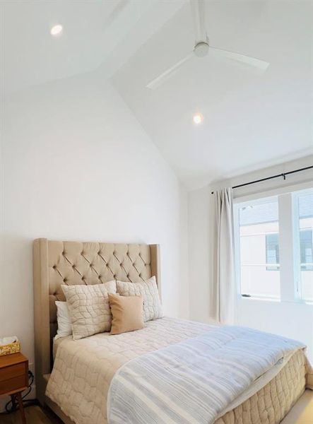 Bedroom with recessed lighting, vaulted ceiling, and a ceiling fan Bedroom with recessed lighting, vaulted ceiling, and a ceiling fan