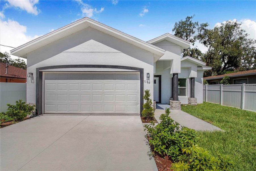 Front exterior of a new home in , Haines City, FL, highlighting curb appeal (Image 17).