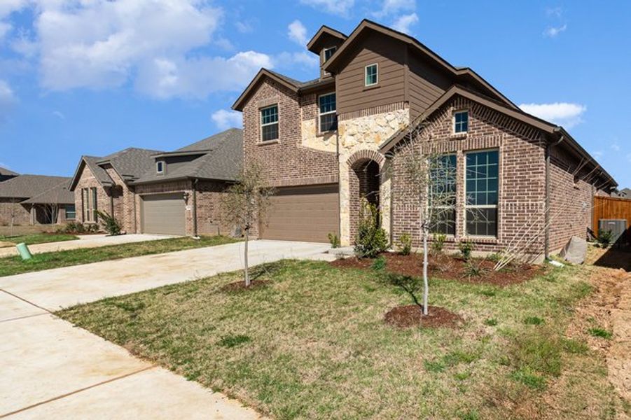 Front exterior of a new home in Courts Of Bonnie Brae, Denton, TX, highlighting curb appeal (Image 17).
