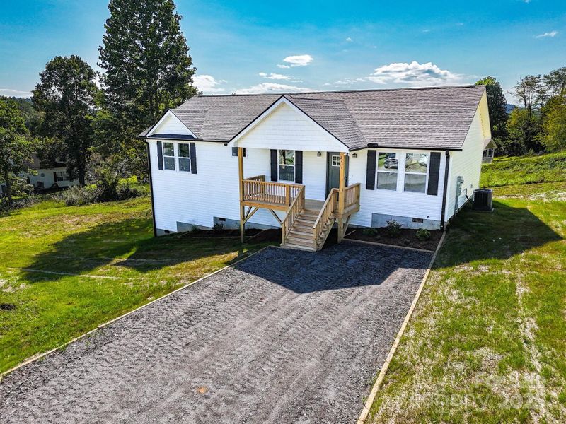 Front exterior of a new home in , Hendersonville, NC, highlighting curb appeal (Image 1).