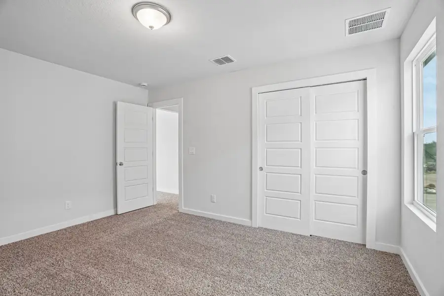 Spacious, unfurnished interior of a new home in The Meadows at Hunters Ranch, San Antonio (Image 30).