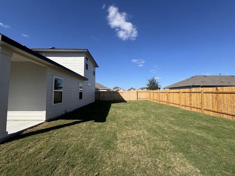 Exterior details and patio area of a home in Village at Three Oaks, Seguin (Image 16).