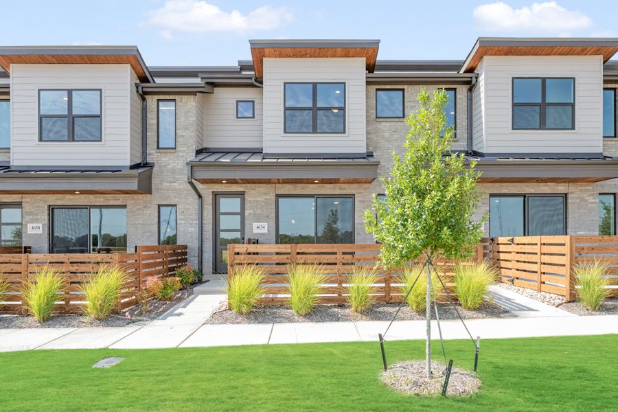 Front exterior of a new home in Wildridge, Oak Point, TX, highlighting curb appeal (Image 2). Front exterior of a new home in Wildridge, Oak Point, TX, highlighting curb appeal (Image 2).