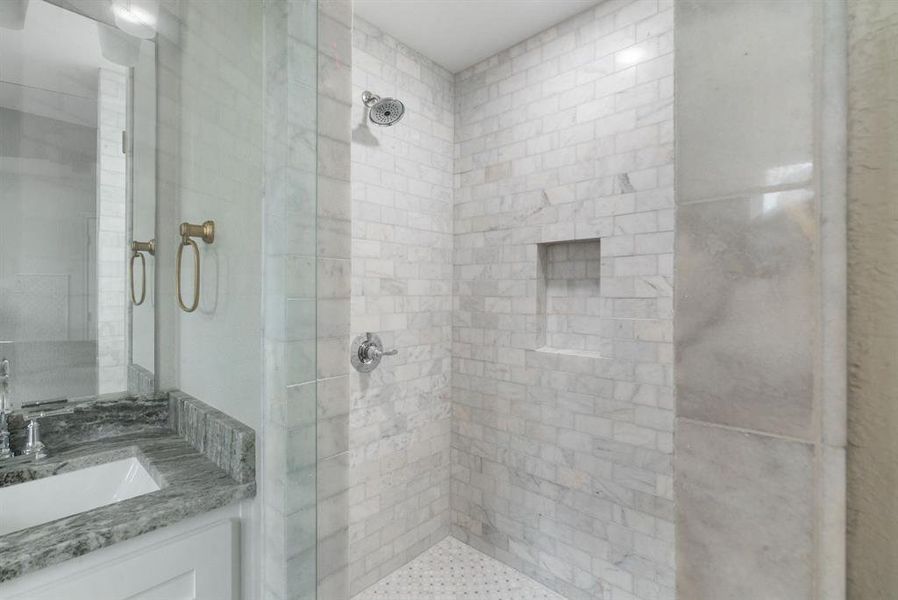 Bathroom with vanity and an enclosed shower Bathroom with vanity and an enclosed shower