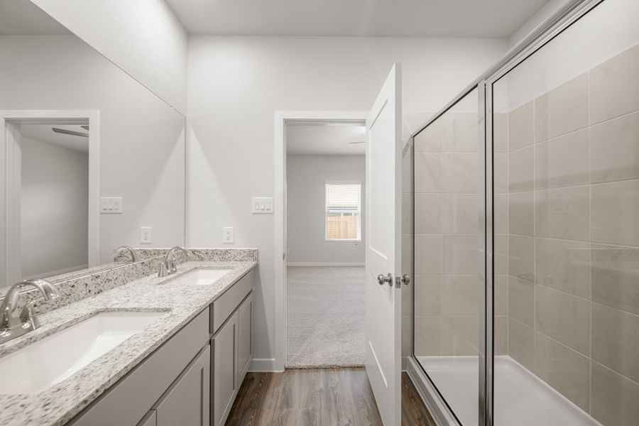 A bathroom with a glass shower.