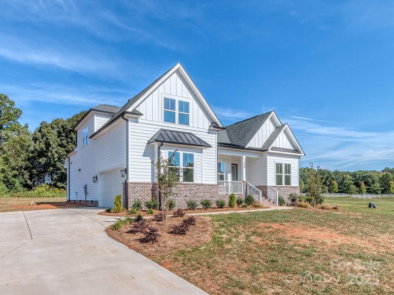 Front exterior of a new home in , Clover, SC, highlighting curb appeal (Image 2).