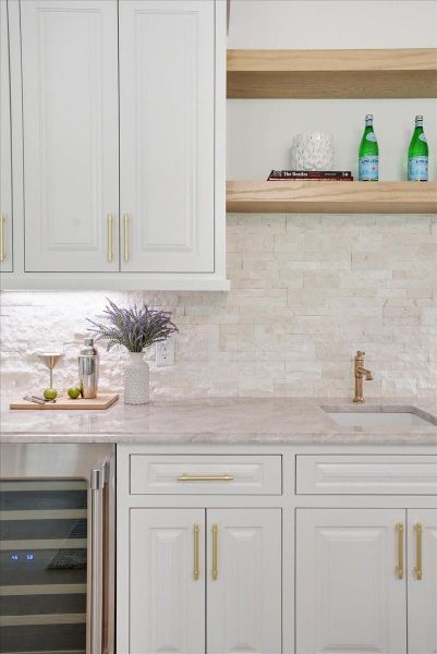 Bespoke stone backsplashes tie the home together.