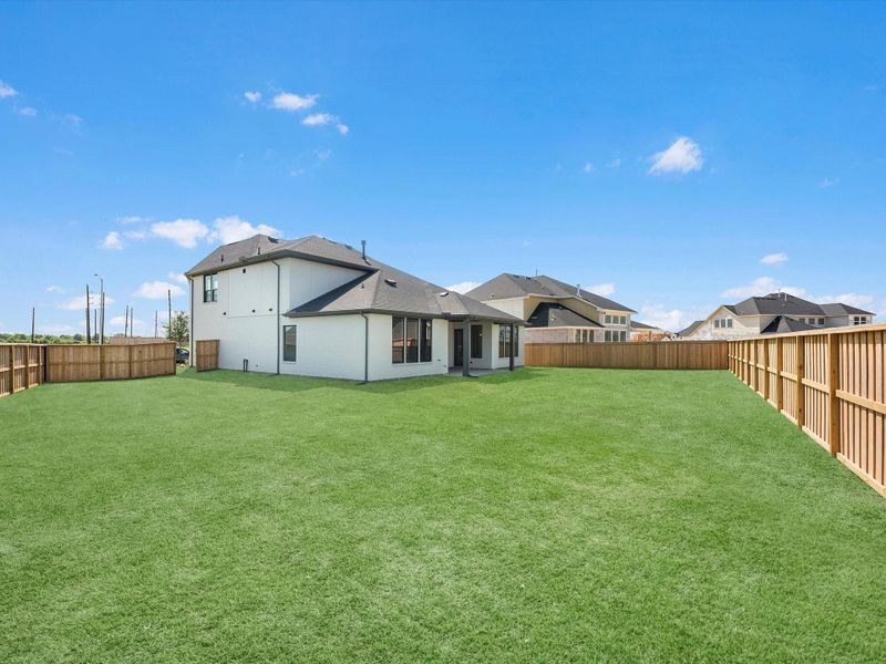 Exterior details and patio area of a home in Dunham Pointe, Cypress (Image 3).