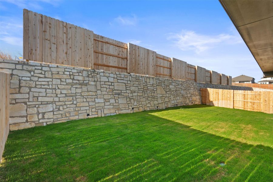 Exterior details and patio area of a home in Lariat, Liberty Hill (Image 23).