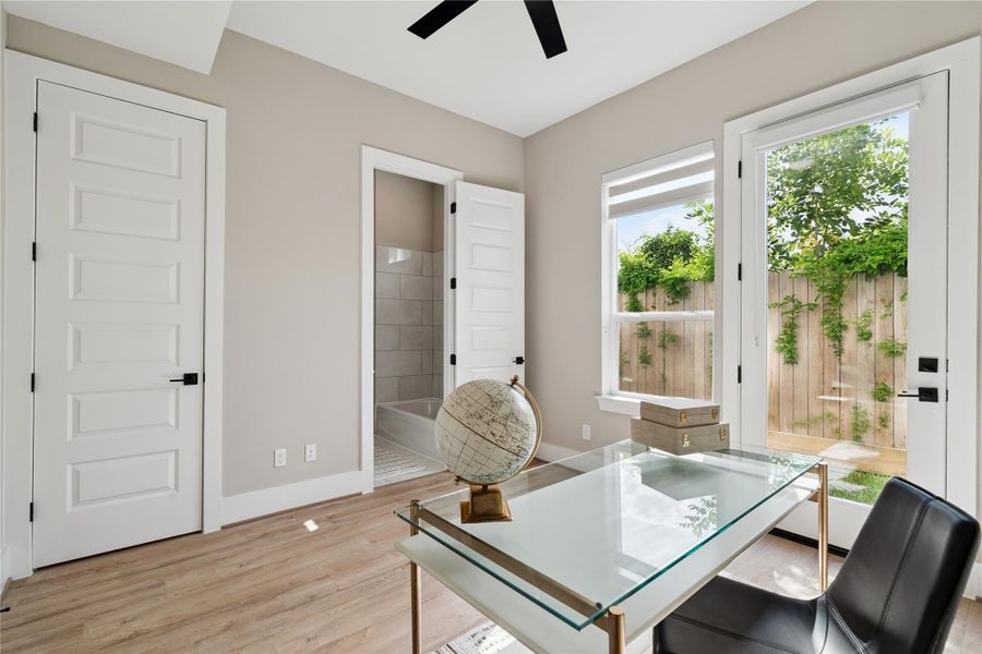 A dual-purpose space with private backyard access, this room’s clean grid and quiet tones reflect thoughtful modern planning.