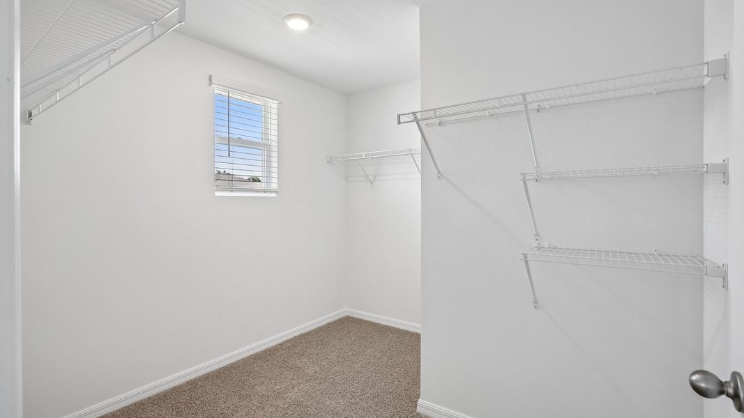 Representative unfurnished interior of a home built from the Robie Modern by D.R. Horton in Berry Bay, Wimauma (Image 14).