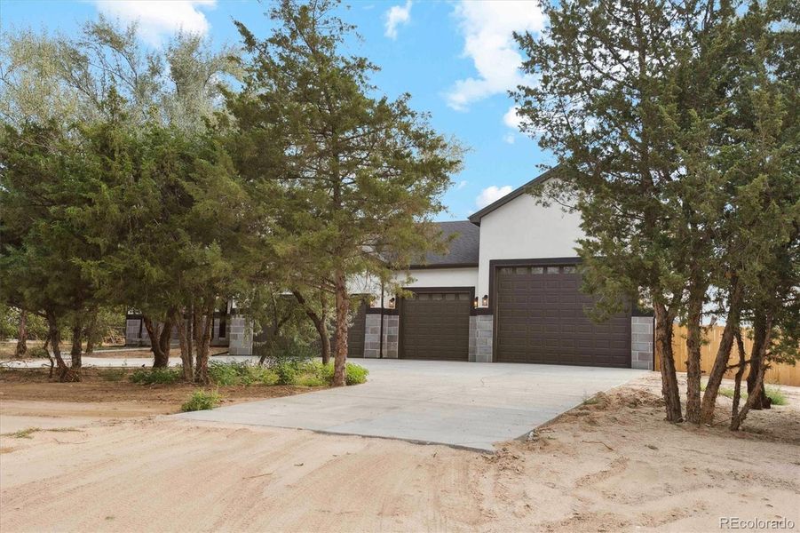 Front exterior of a new home in , Brighton, CO, highlighting curb appeal (Image 24).