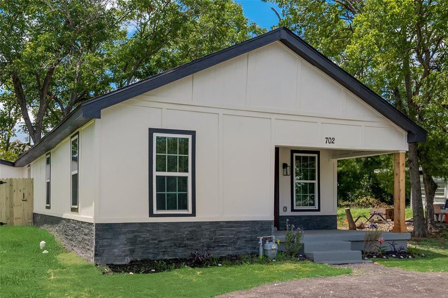 View of front of house with a front lawn