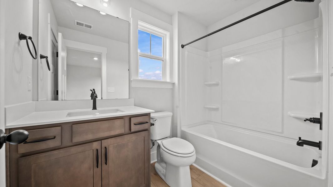 Representative furnished interior of a home built from the Kendrick - Finished Basement by DRB Homes in Pinebrook, Woodruff (Image 22).