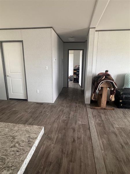 Hall featuring dark wood finished floors Hall featuring dark wood finished floors