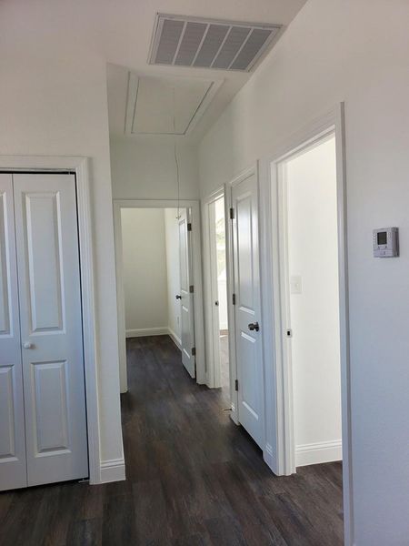 hallway with laundry to serve each bedroom conveniently