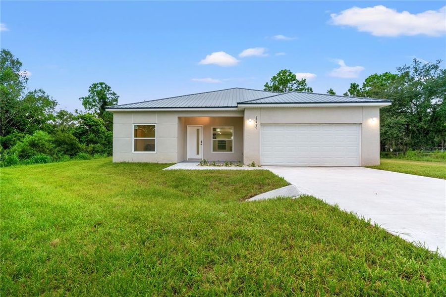 Front exterior of a new home in , Orlando, FL, highlighting curb appeal (Image 16). Front exterior of a new home in , Orlando, FL, highlighting curb appeal (Image 16).