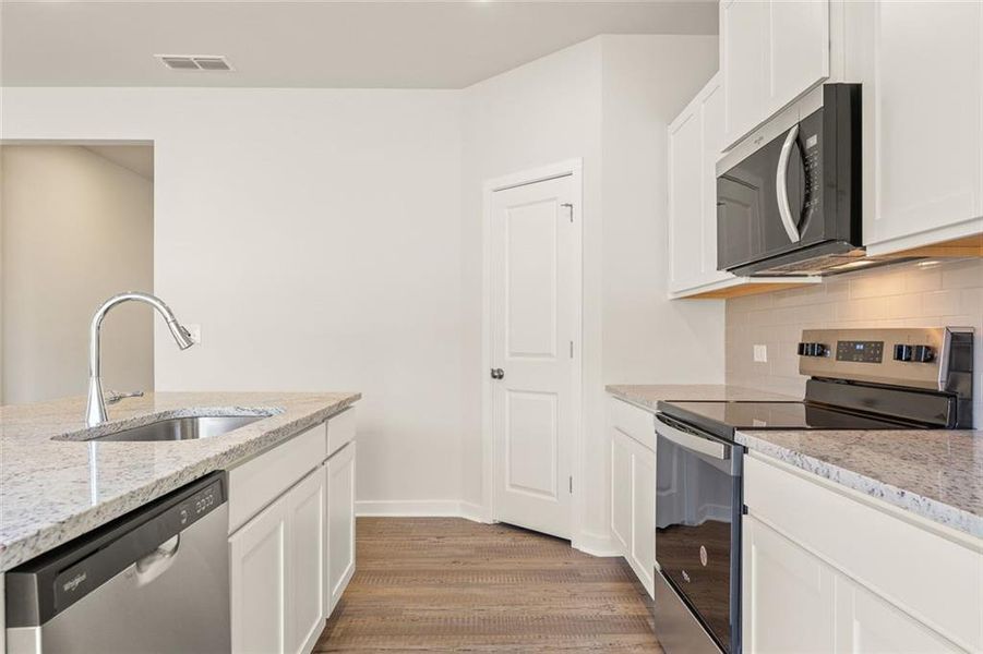 Furnished interior view inside a new home in Belleview Manor, Fairburn (Image 9).