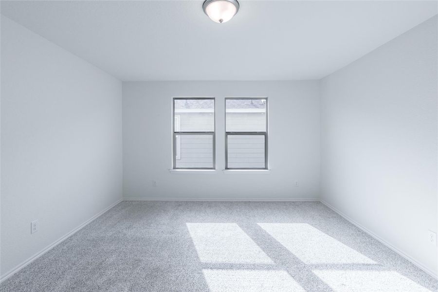 Sun-filled room with plush carpeting offers a versatile canvas for living or working. Sun-filled room with plush carpeting offers a versatile canvas for living or working.
