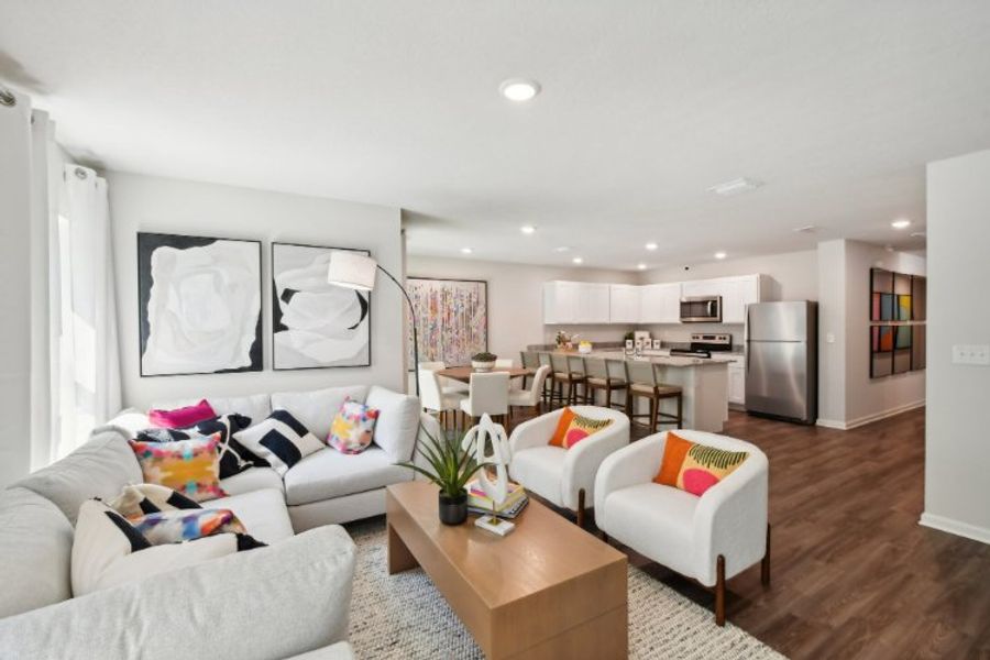 A living room with a wood floor.