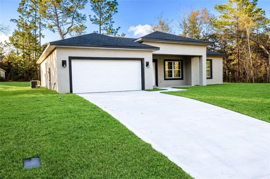 Front exterior of a new home in , Citrus Springs, FL, highlighting curb appeal (Image 20).