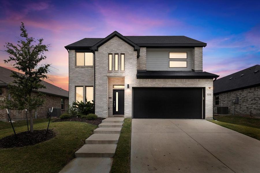 Front exterior of a new home in DeBerry Reserve, Royse City, TX, highlighting curb appeal (Image 2). Front exterior of a new home in DeBerry Reserve, Royse City, TX, highlighting curb appeal (Image 2).