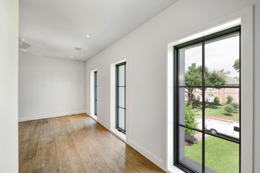 Second bedroom has ensuite bath and windows overlooking the front yard.