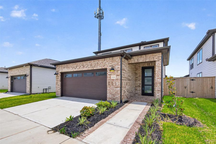 Front exterior of a new home in , Stafford, TX, highlighting curb appeal (Image 28). Front exterior of a new home in , Stafford, TX, highlighting curb appeal (Image 28).