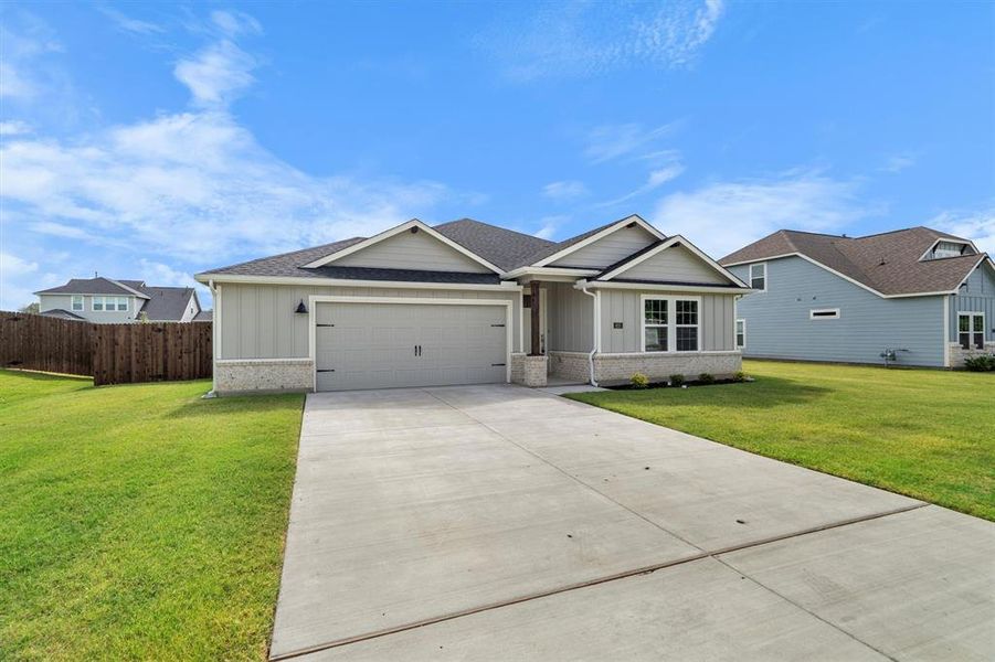 Front exterior of a new home in The Gables At Tioga, Tioga, TX, highlighting curb appeal (Image 28). Front exterior of a new home in The Gables At Tioga, Tioga, TX, highlighting curb appeal (Image 28).