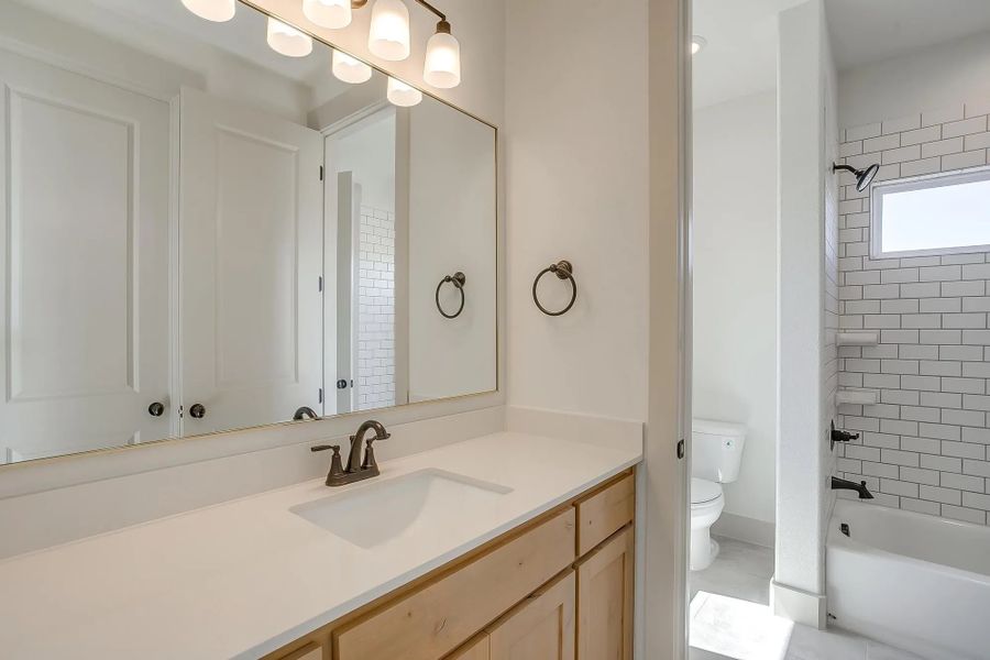 Representative furnished interior of a home built from the The Carley by Elmwood Custom Homes in Matthews Farm, Venus (Image 21).