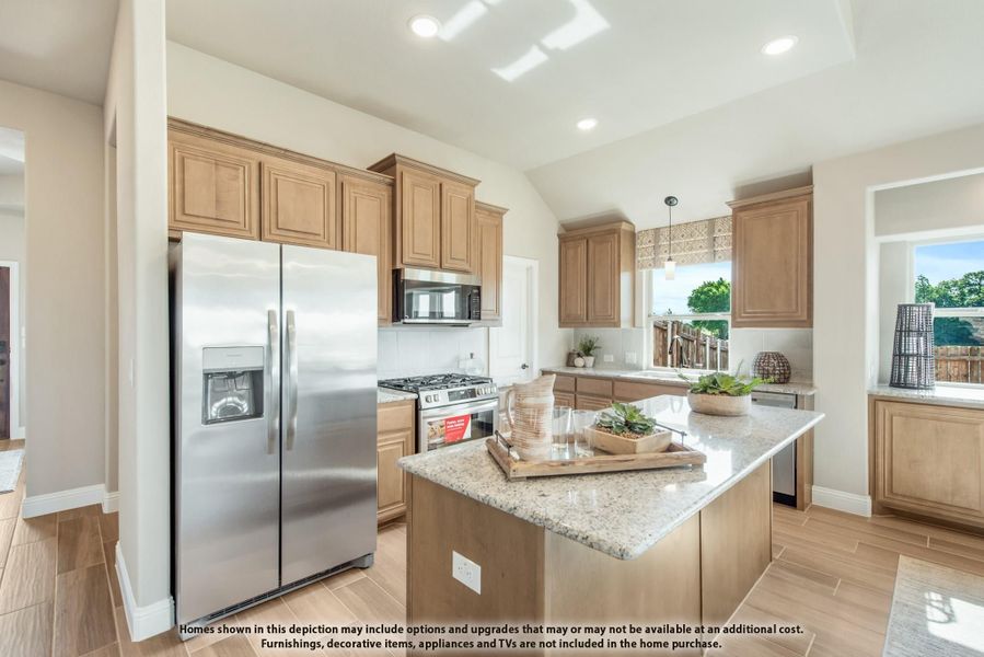 Kitchen with wood cabinets, granite island, stainless steel appliances, and vaulted ceiling