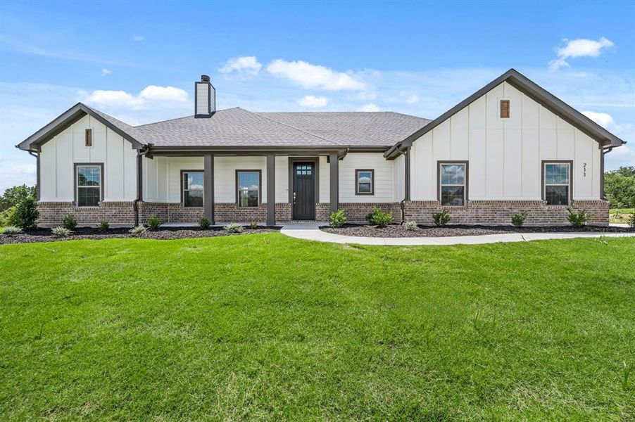 Front exterior of a new home in Saddleback Estates, Boyd, TX, highlighting curb appeal (Image 20).