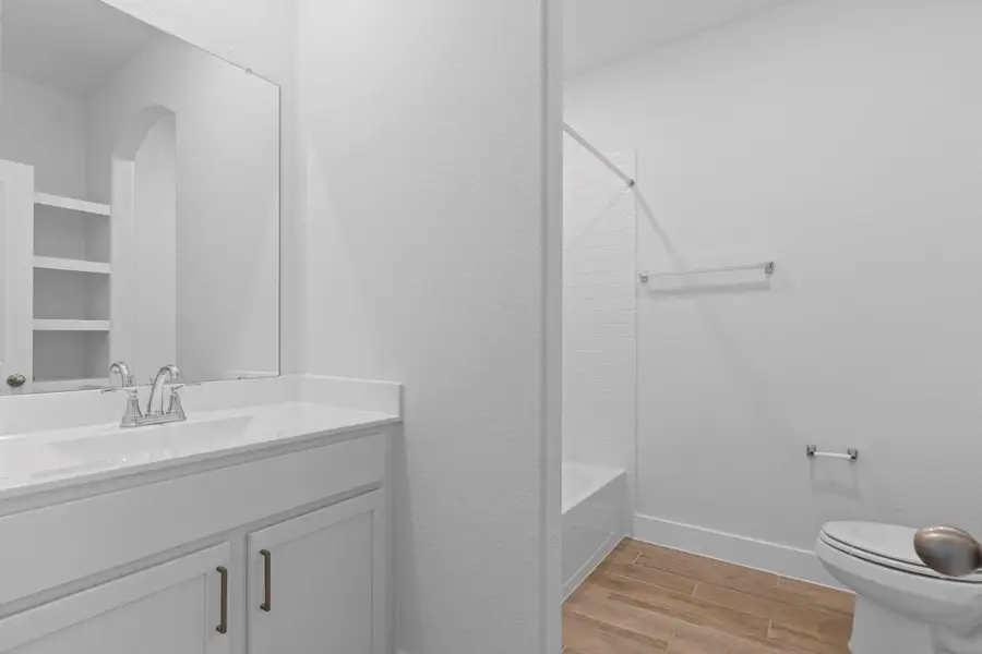 Large guest bathroom with large vanity beautiful shaker cabinets with gorgeous hardware, tub and shower combination. Large guest bathroom with large vanity beautiful shaker cabinets with gorgeous hardware, tub and shower combination.