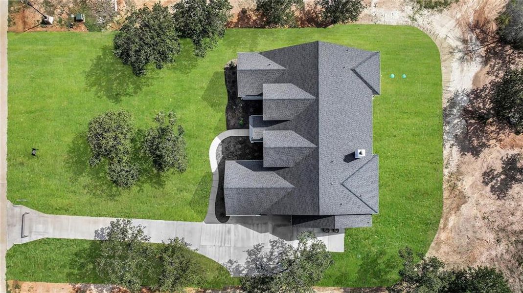 Front exterior of a new home in , Weatherford, TX, highlighting curb appeal (Image 26). Front exterior of a new home in , Weatherford, TX, highlighting curb appeal (Image 26).