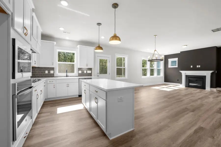 Representative furnished interior of a home built from the Happy by Garman Homes in Golden Gate, High Point (Image 3).