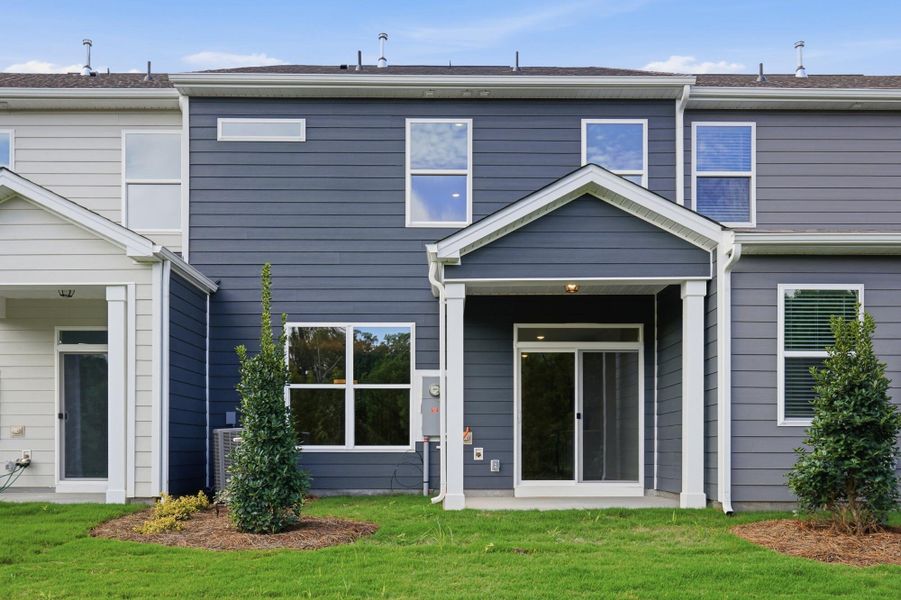 Exterior details and patio area of a home in Blythe Mill Townhomes, Waxhaw (Image 19).