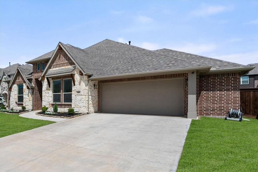 Front exterior of a new home in Somerset, Mansfield, TX, highlighting curb appeal (Image 1). Front exterior of a new home in Somerset, Mansfield, TX, highlighting curb appeal (Image 1).