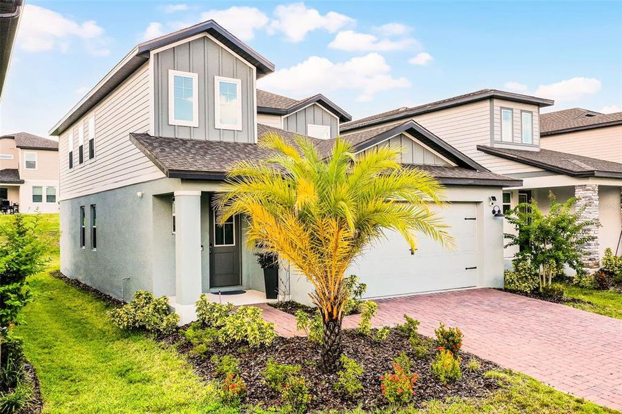 Front exterior of a new home in , Minneola, FL, highlighting curb appeal (Image 19).