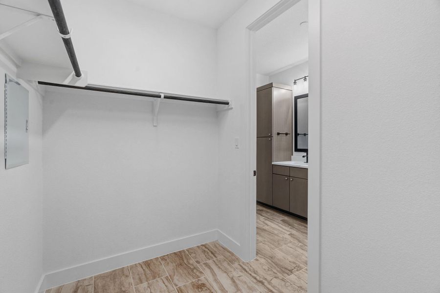 Spacious primary walk-in closet