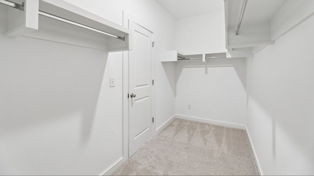Primary Closet with built-in shelves